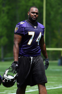  What position does Michael Oher play for the Baltimore Ravens?