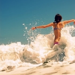  My icon is a picture of a girl in her panties and underwear splashing through the ocean.