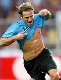  Mine is Diego Forlan (a soccer player from Uruguay who won the golden ball in the last world cup) celebrating a goal he scored kwa inaonyesha us his abs <3 (which he always does!) !!!
