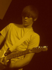  Dalton playing away at his đàn ghi ta, guitar