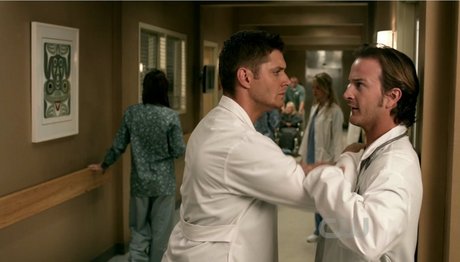 Dean on the operating table while Sam operates on him