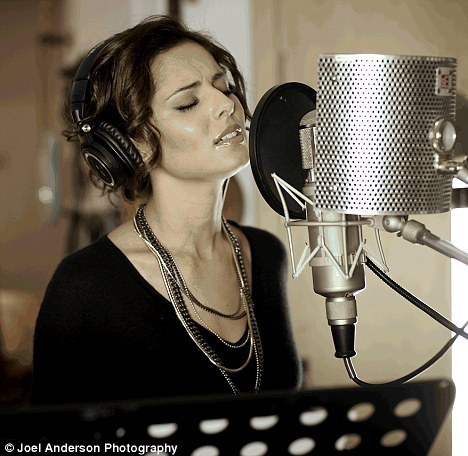  Cheryl recording the Haiti charity single
