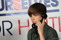 J.Bieber with a phone{hope for haití} - justin-bieber photo