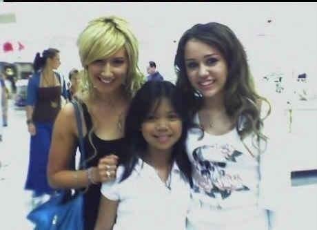 ashley and miley with a fan