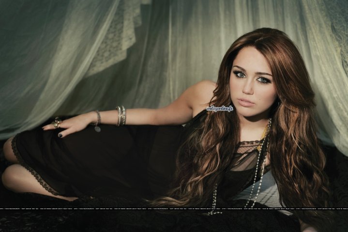http://images2.fanpop.com/image/photos/12300000/i-can-t-be-tamed-miley-cyrus-12300093-719-479.jpg