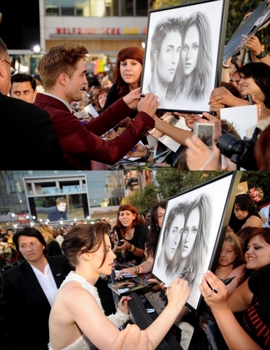  Robert Pattinson and Kristen Stewart sign 粉丝 art at the 'Eclipse premiere'