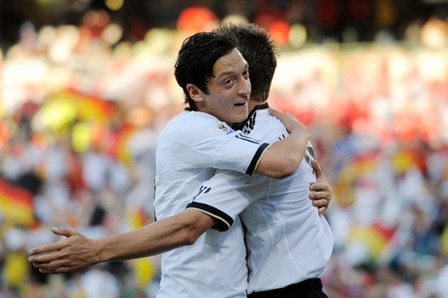 Mesut Özil celebrating goal with teamate Miroslav Klose (hug)