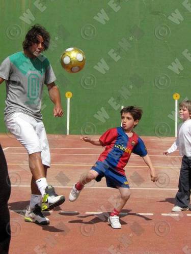  rafa plays football with child