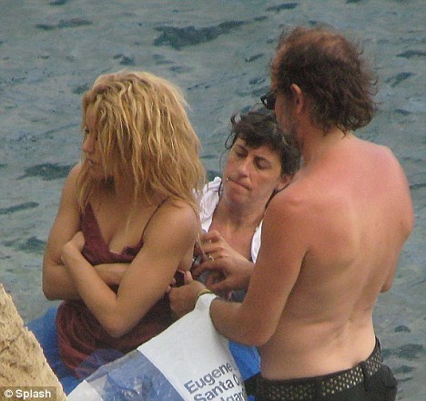 Chilly: After the shoot Shakira gets helped into a different dress