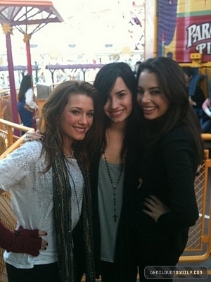 demi at disney land with her family 