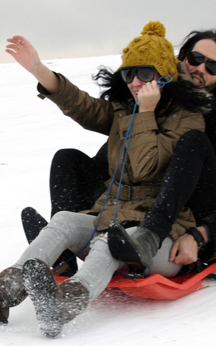 Russell and Katy sledging in London
