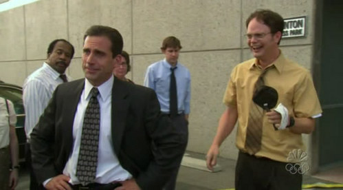 In "The Fire" episode, what does Dwight go back in the building to get for Michael?