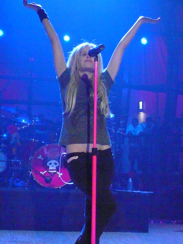  Which band played as an opening act for Avril's first tour?