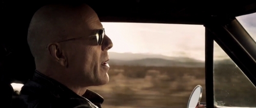 In the video clip "Stylo" by Gorillaz, what color is Bruce Willis' car ?