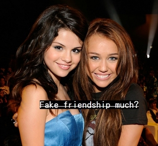  Okay, sorry ahead of time for my super long answer. I'm pretty sure that Miley and Selena don't like each other. I mean, you've gotta admit that that vid that Miley and Mandy made was really harsh, and not at all "just for fun" like they claim. The girls clearly can't stand each other. But, the ONLY reason they tolerate each other and claim that they're "good friends" of that "there's no feud going on" is because of Disney. Disney basically told them to play nice, suck it up, and act like u can stand each other. I mean, how would it look if Miley and Selena hated each other? That would cause bad publicity now wouldn't it? Disney wouldn't ever want bad publicity so they basically censor and put down the alleged fight. Not to mention the fact that a bunch of parents would teef and moan that Miley and Selena "aren't setting a good example for kids" and all that sh*t that the saint moms like to preach. So yeah, I'm sure Disney zei "take some pictures together, invite her to a party, do whatever it takes to convince kids out there that you're friends, even if u just want to kill each other." There are clearly hard feeling between them (who WOULDN'T be upset if some b*tch geplaatst a video making fun of you, just because she's jealous that you're dating her ex-bf?). Plus, now with the added fact that Nelena broke up and Nick is currently back with Miley makes an even meer strained relationship. Unfortunately for Disney, I don't buy all the bullsh*t that they try to say. All the pictures of Miley & Selena are blaringly awkward and posed. It's all fake smiles. Just look at the picture below. Like I said, it's all fake, forced smiles. Miley looks like she's practically gritting her teeth. u can tell Selena is screaming in her head "get me away from this slut! I might catch something being this close to her!" The picture speaks for itself. Oh, and one last thing, u may read in magazines how Miley and Selena are "buddies," but here's the truth: J-14, Bop, Twist, Quizfest, PopStar!, Tiger Beat, Astro Girl, M, all those tween magazines are indirectly OWNED door DISNEY! They can put whatever they want in there to try and censor the truth. Just letting u know that when u read those magazines, you're reading the watered down version of the truth.