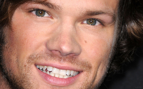 His eyes are a smoky-blue with hazel centers. I have an extreme closeup photo of him that proves it. See? LOL!