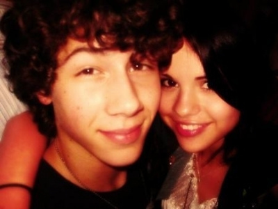 Reply to niley22.
They are not back together Nick said and quoted that he chose Miley to do the song with him because he was sick of everyone saying there was a feud between them so that was what before the storm was about. He is obviously happier with Selena because you can see that when he is around Miley he doesnt smile but when he is with Selena ther is always a smile on his face. Here are the photos to prove.

