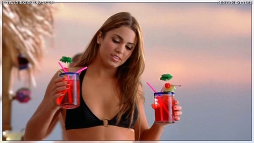 What is the name of the red drink Nikki is holding in this picture? Please tell.