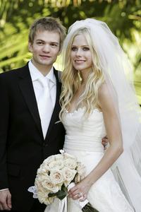  Deryck Whibley who is the lead singer/guitarist of punk band Sum 41 , They married on July 15, 2006.