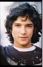  rumor has it that it's Tyler Posey... he isn't as cute as i would have imagined. instead kind've dull. for crying out loud! his ceps are not as equvilent to Taylor Lautner's though!!