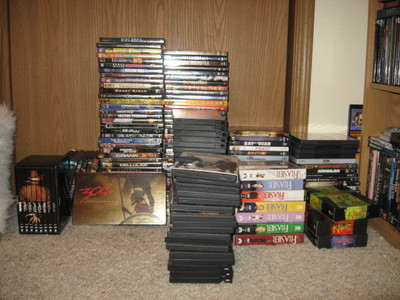  This is the stack of DVD's on the floor in front of my shelf. They are (from right to left and back t