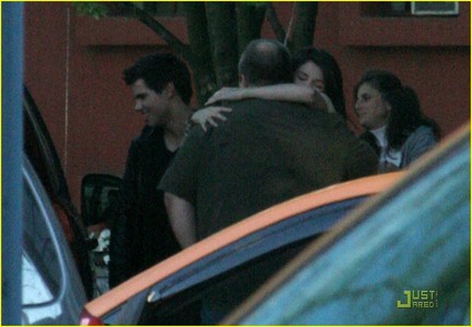 Selena Gomez and Taylor Lautner chat it up together as they leave a downtown Vancouver restaurant on 