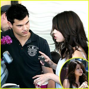 Selena Gomez and Taylor Lautner keep close together as they stop for some frozen yogurt together in L