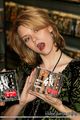 Hilarie Burton holding a CD Disk - hilarie-burton photo