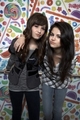 Dem and Sel in front of a candy background - selena-gomez-and-demi-lovato photo