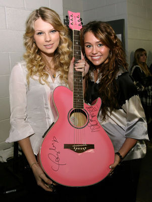 http://images2.fanpop.com/images/photos/5600000/Miley-Taylor-miley-cyrus-and-taylor-swift-5608570-301-400.jpg
