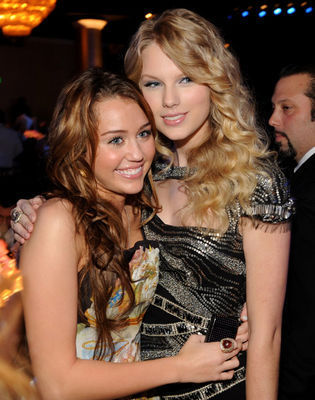 http://images2.fanpop.com/images/photos/5600000/Miley-Taylor-miley-cyrus-and-taylor-swift-5608610-315-400.jpg