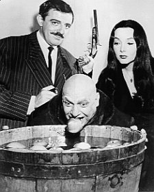 http://images2.fanpop.com/images/photos/5600000/Morticia-Gomez-and-Uncle-Fester-addams-family-5601585-225-280.jpg