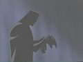 batman putting on his mask - batman-the-animated-series photo
