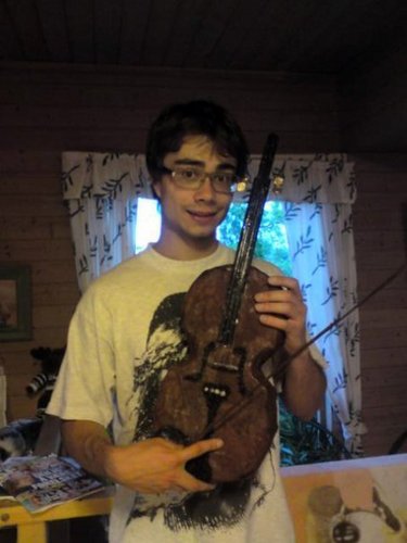 Alex and a chocolate violin he got from some fans from Belarus