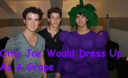 Joe Jonas in a grape constume.