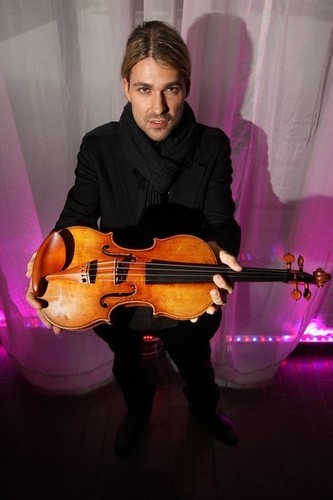  Violinist David Garrett stands with a replacement Stradivarius violin