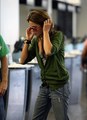 Nikki- at the airport heading to eclipse filming - nikki-reed photo