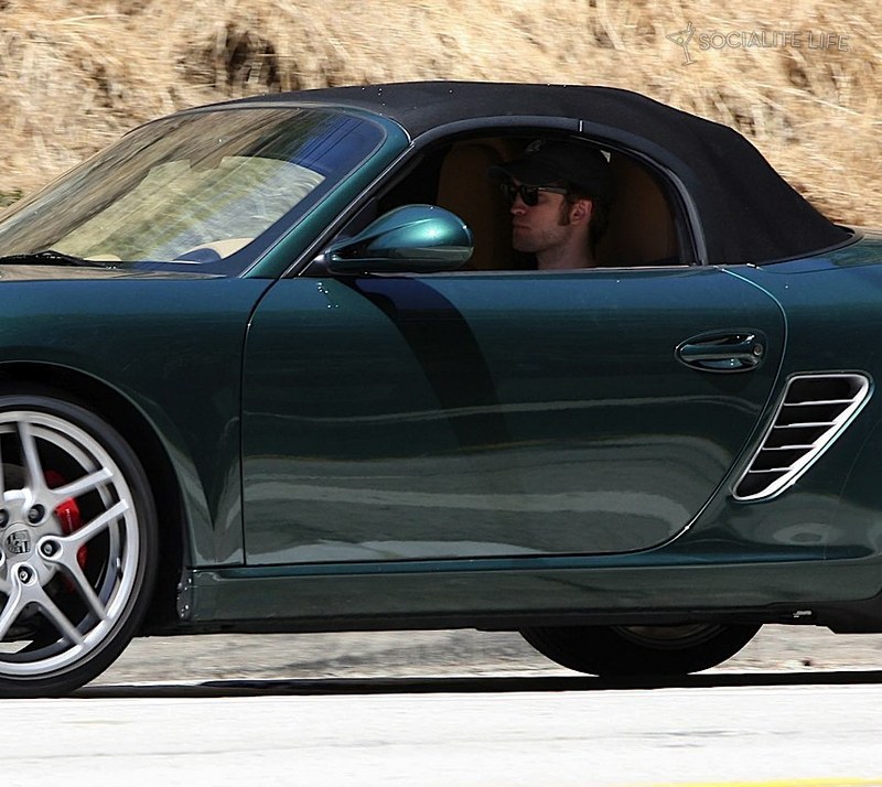 Robert Pattinson is driving away from Kristen Stewart's house in a Porche