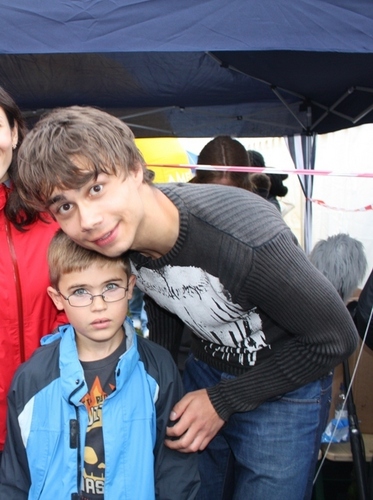  Alex with a young Фан of his:)