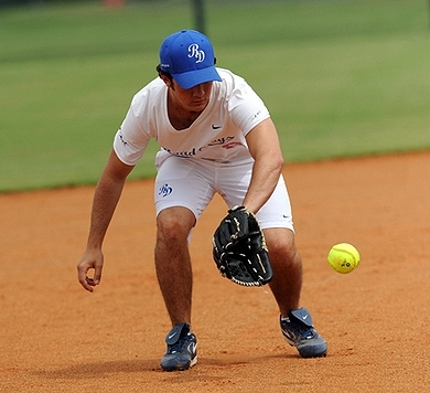 Playing softball. 