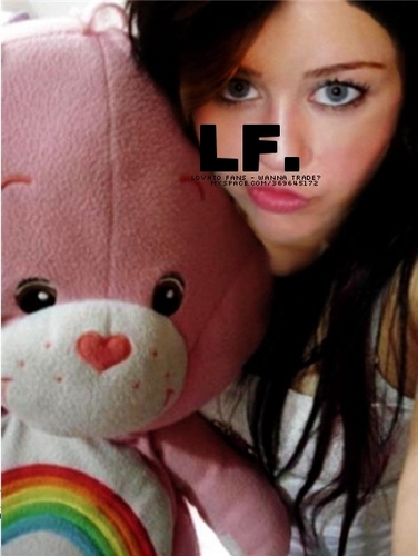 miley cyrus with a pink bear