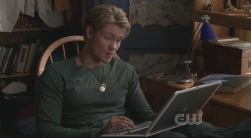  What is Luke doing on his laptop?
