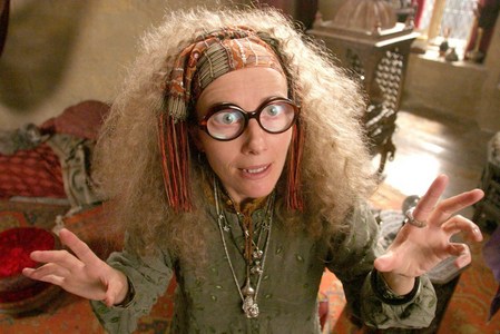 When Harry and Ron first met Trelawney what kind of earings was she wearing?