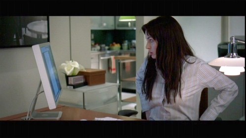  What's the background of Andy's computer at work?