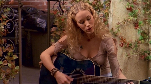  In 'Sleep Tight,' one of Lorne's clients (her name is Kim) is Пение in the courtyard. Who wrote the song she is singing?