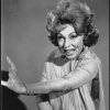  In episode #141 "Samantha's Wedding Present", what does an angry Endora do to Darrin?