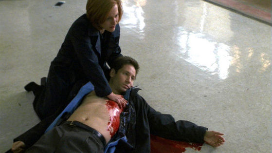 Season Six Monday # ~ Scully Holds Mulder In Her Arms After Hes Been Shot