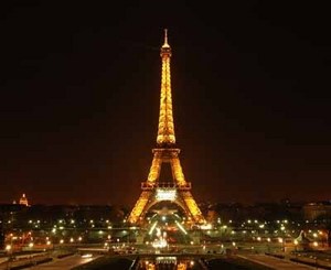  the veiw of the eiffel tower at night, except in the story only the tower was lit