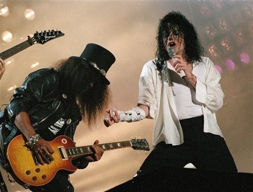  Performing Black o White, with the rock-legend slash