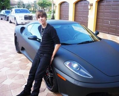 Justin Bieber by his Car
